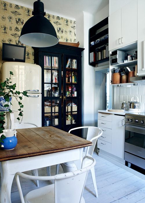 small table, black cabinet, white smeg