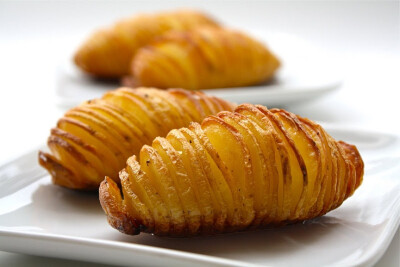 Better than fries! Cut potatoes almost all the way through, drizzle olive oil, butter, some sea salt, and pepper over top and bake @ 425 for 40 minutes.