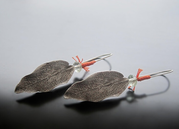 Sage leaf earrings Sterling silver, fluorite, embroidery thread.