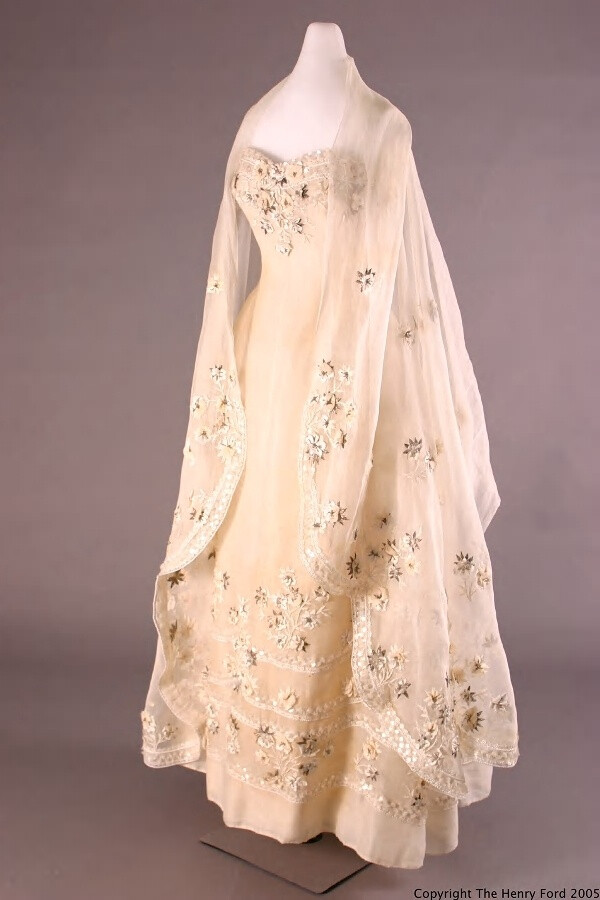 Stole,1955.White cotton organdy gown with floral pattern embroidery includes white raffia,