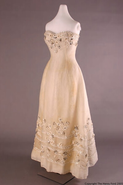 Stole,1955.White cotton organdy gown with floral pattern embroidery includes white raffia,