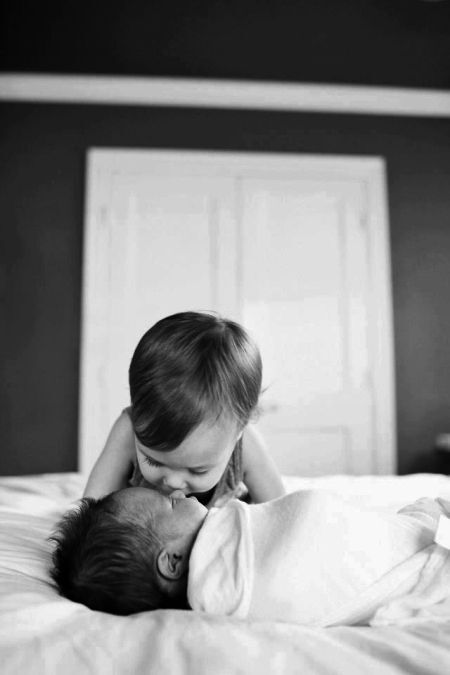 Photos of babies. Sibling photo shoot. Black and white. Perfect moment captured.