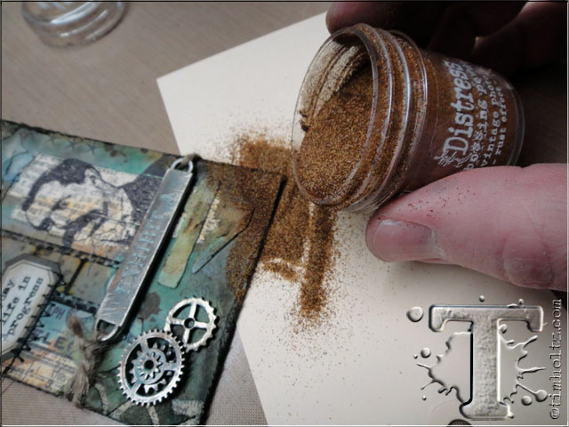 step 25: this time i want to share another cool way to use distress embossing powder…creating a rust effect!  shake distress embossing powder first, and pour over embossing ink areas.