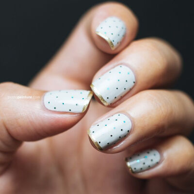 polka dot manicure with gold tips