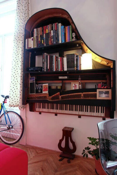 Recycled old broken piano = fabulous bookcase