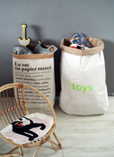 Paperbags storage by merci-merci.com+ kolor.de and cool little vintage kids rattan chair with mini rodini bag as a cushion. By thecoolheads.com