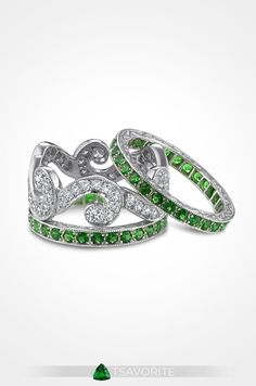 Also known as a green garnet, tsavorite is one of the more rare garnets as it needs unique conditions to form. This platinum Fusaro Jewelry wedding ring features a gorgeous diamond swirl pattern with tsavorite guards.