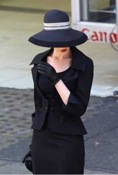 Dior - I think this is a pic of Anne Hathaway. I remember this suit from a photo shoot just before TDKR