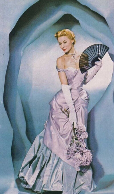 lilac and blue off the shoulder evening gown by American couture designer Charles James.