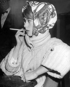 Catherine Deneuve (wearing Hermès scarf) waiting at JFK airport, 1961