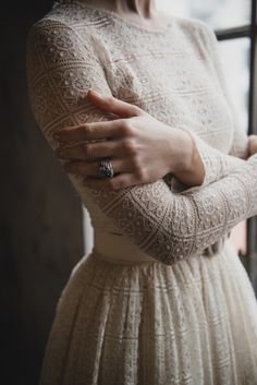 What a lovely and gracious, ladylike dress. The subtle color of ivory or cream or beige....speaks softly but has such a presence. I love the combination of the soft color that does not roar and the nubby texture of the crochet. This is a masterful shirtwaist style!