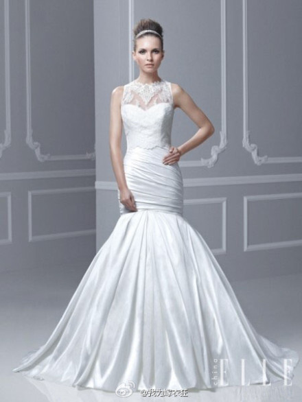 Enzoani Bridal 2015春夏新款婚纱，秉承一贯高贵典雅的风格，回归传统纯白色婚纱礼服，将褶皱充分运用在裙摆上，让古典宫廷样式与现代简约感充分结合在一起。