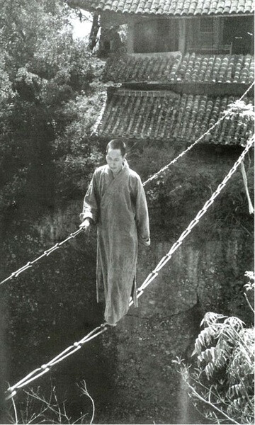 The Jiangyou Figure Hill Temple. Simple iron chain bridge, China, 1930s