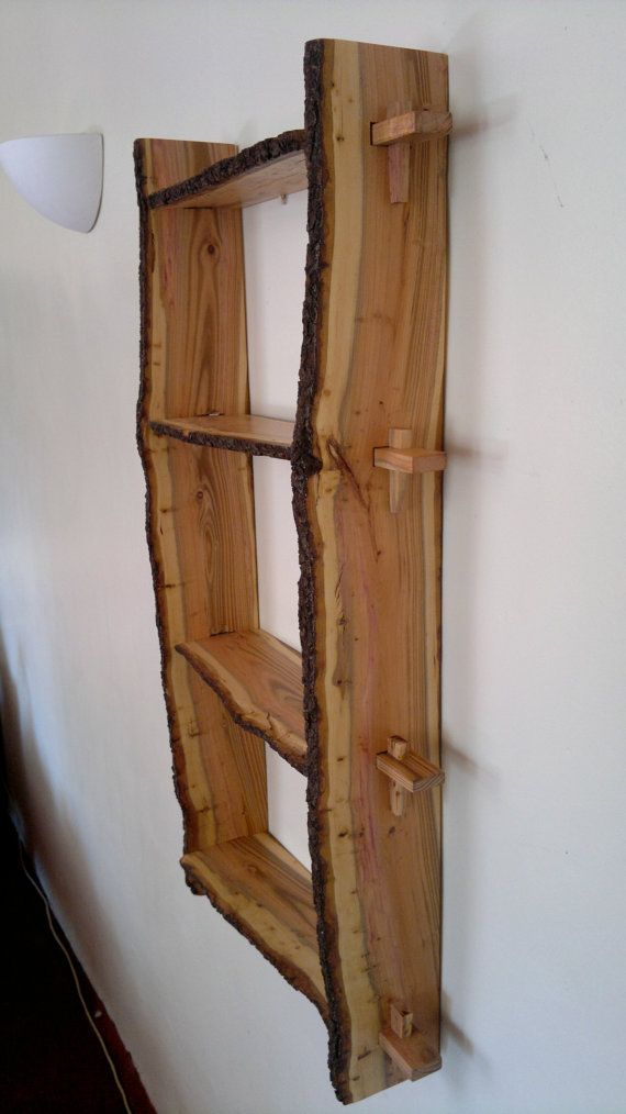 Plum wood shelves. Natural edge, wall-mounted, handmade from bookmatched planks. £149.90, via Etsy.