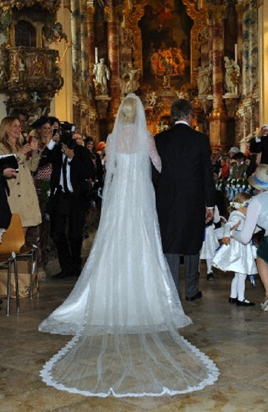 Princess Felipa of Bavaria with her father Prince Leopold of Bavaria walk down the aisle at the Rokoko-Wies church on 12 May 2012