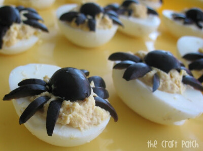 Halloween food - spider deviled eggs, buy maybe with paprika body and red pepper legs?