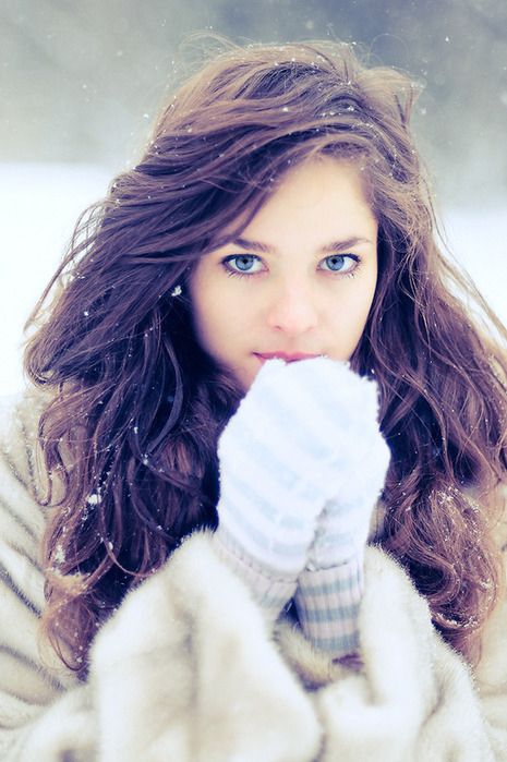 Excellent winter pose, the snow flakes in her hair also make this photograph excellent.