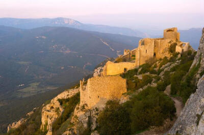 CHÂTEAU DE PEYREPERTUSE, LANGUEDOC-ROUSSILLON, FRANCE As you meander along mountain roads in France's far southwest, hilltop fortresses loom above, some standing proud, others only snaggle-tooth ruins…