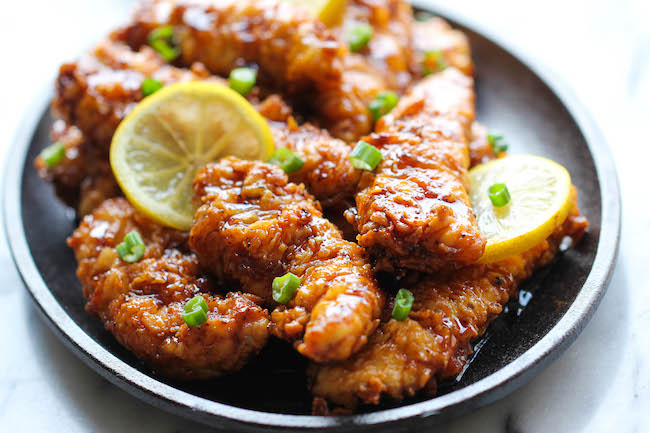 Asian Lemon Chicken Tenders - A wonderful asian twist to your favorite chicken tenders, tossed in the most heavenly sweet, lemon glaze!