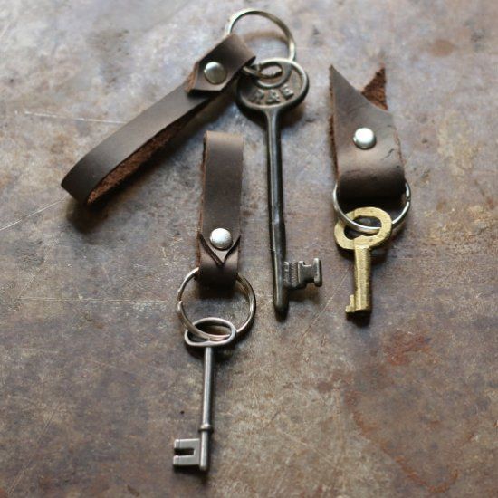 Create these sturdy and simple leather keychain fobs from leather scraps and a single rivet — they make for a welcome housewarming gift!