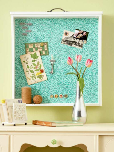 Upcycle an old dresser by taking one of the drawers and hanging it up for use as a bulletin board.