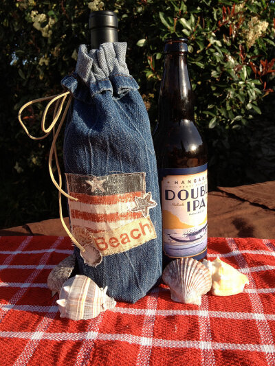 Denim Wine Carrier Given the nature of the material, denim is a good insulator, which makes it perfect as a wine bottle carrier.