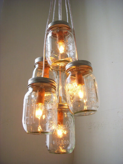 Mason Jar Chandelier With a bit of work, but you can make chandeliers out of mason jars. For an easier DIY route, use candles instead of electrical lighting.