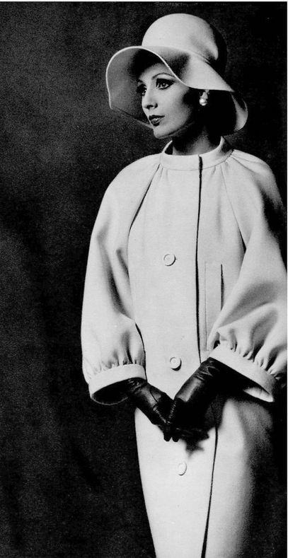 1962 Model in ivory velvet-wool coat with raglan sleeves and banded collar and cuffs by Nina Ricci, photo by Georges Saad