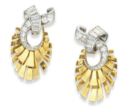 A PAIR OF RETRO DIAMOND AND GOLD EAR CLIPS, BY VAN CLEEF &amp;amp; ARPELS Each designed as graduated baguette and circular-cut diamond interlocking scrolls, extending a two-tiered polished gold fan, m…