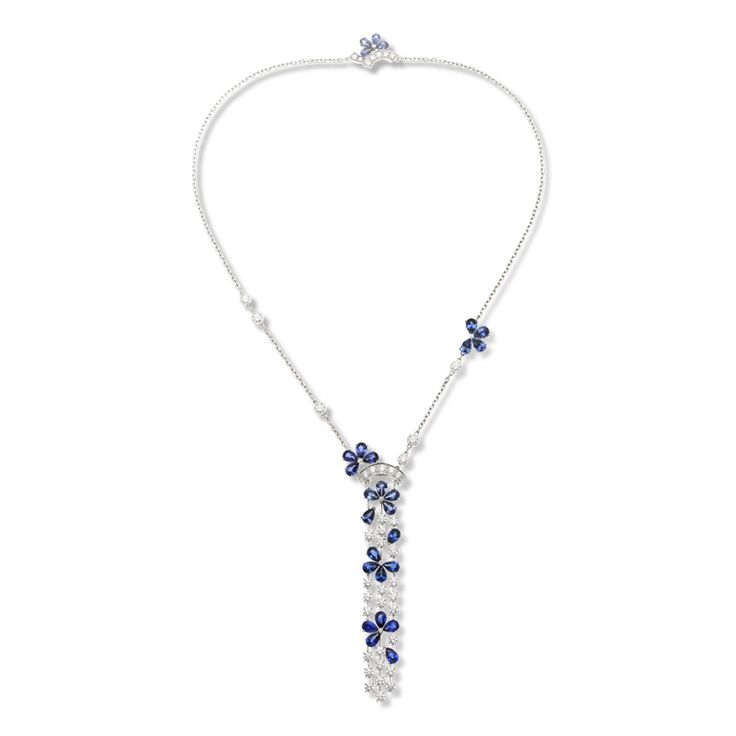 Petals from the flower market on Paris' Ile de la Cité, swept up by the wind to float on the waters of the Seine, offer inspiration for the Fil de l’Eau collection. Sapphire flowers cascade down a stream of diamonds for this delicate pendant with a jeweled clasp.