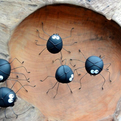 Make playful spiders from the tumbled rocks then leave them around the garden for the children to find.