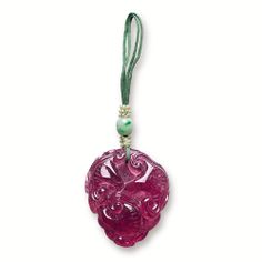 CARVED PINK TOURMALINE, JADEITE AND SEED PEARL PENDANT, LATE QING The translucent tourmaline of rich pink colour, carved with ruyis and a bat, symbolising happiness and luck, suspended from a green co…