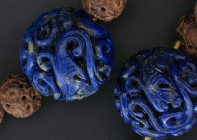 Close-up view of the Qing Dynasty Mandarin Court necklace glass beads.