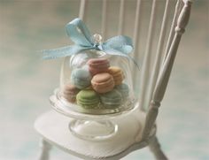 Dollhouse miniature sweet macaroons on glass display stand