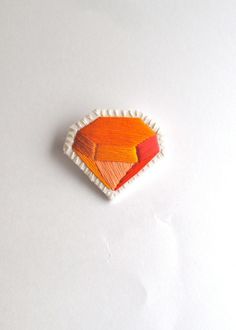 Embroidered orange diamond brooch