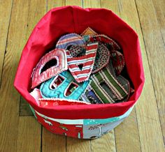 a bucket of letters made from scrap fabrics