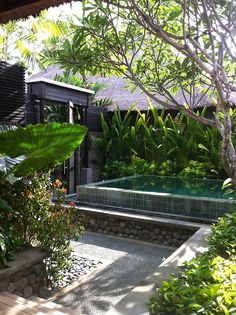 Balinese style pool and garden. Natural materials and big leafy plants, it's hard to go wrong. Pinned to Pool Design by Darin Bradbury of BASK Pool Design.