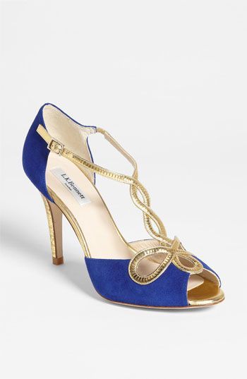 L.K. Bennett 'Nelly' Sandal Precision gilt marries royal appeal with Egyptian edge for a crowning achievement in evening-ready elegance. Adjustable strap with buckle closure. Approx. heel height: 3 1/2&amp;quot;. Suede and metalli