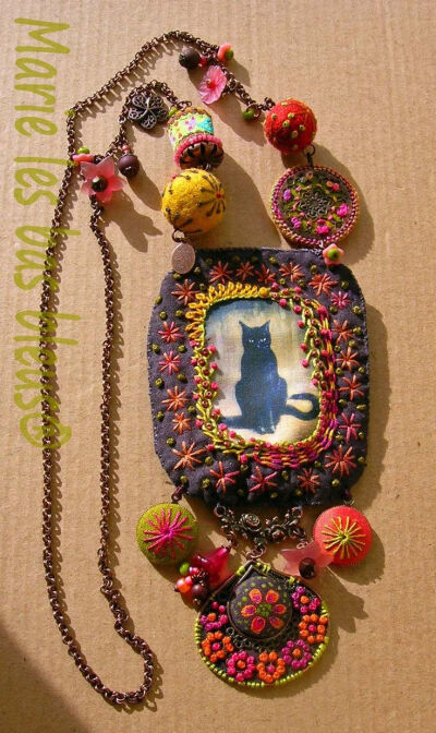 Create an assemblage necklace out of hand dyed and embroidered fabric.