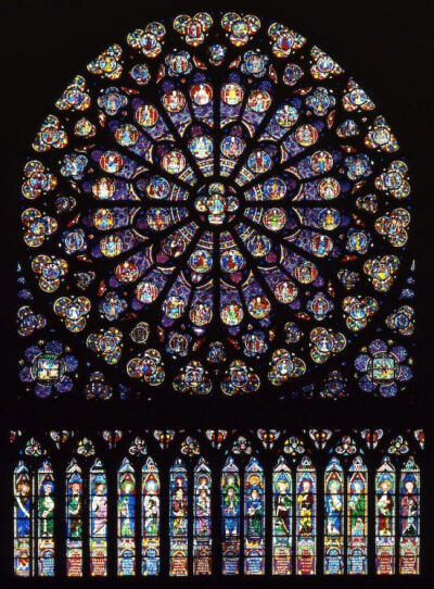 玫瑰窗（The rose window）| 也称玫瑰花窗，为哥特式建筑的特色之一，指中世纪教堂正门上方的大圆形窗，内呈放射状，镶嵌着美丽的彩绘玻璃，因为玫瑰花形而得名。