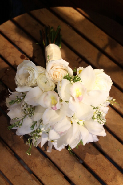 The ultimate Spring wedding bouquet. Cymbidium orchids, roses, ranunculus and wax flower bouquet. All these flowers ar...