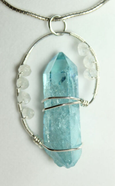 Wire wrapped gemstone crystal piece. What a creative and interesting way of making a pendant: