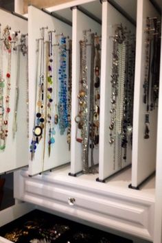 Pull-out boards on sliders for hanging necklaces, bracelets and earrings!