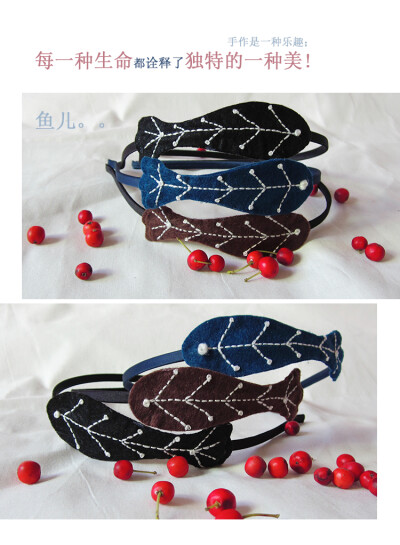 可爱的刺绣小鱼仔仔戴在头上。