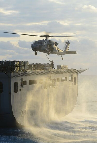 An MH-60S retrieves cargo from USNS William McLean. by Official U.S. Navy Imagery: