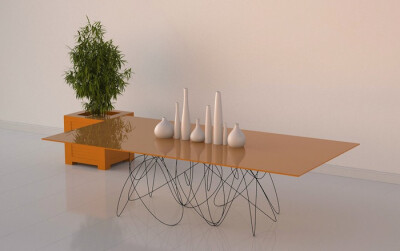 美国设计师 Jason Phillips 带来的「量子餐桌＼Quantum Table」设计，通过看上去细微而潦乱的独特桌腿， Jason 向我们解释了亚原子粒子的运动和路径可能的样貌。餐桌表面由喷涂了橙色漆的可丽耐材料制作，底部则是大…
