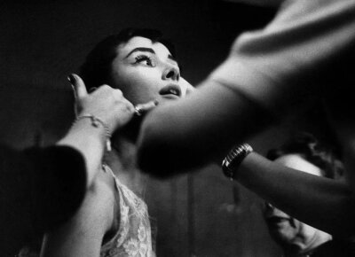 Audrey Hepburn on stage accepting her Oscar for Best Actress in a Leading Role for her performance in Roman Holiday in New York, March 25th, 1954 ​​​