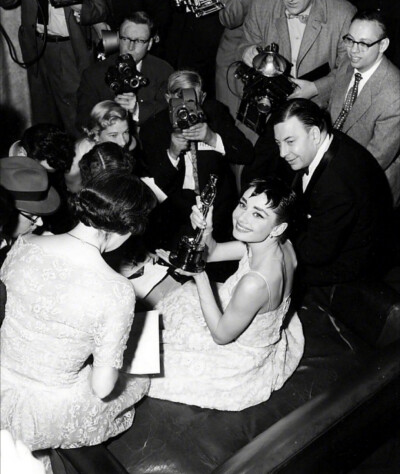 Audrey Hepburn on stage accepting her Oscar for Best Actress in a Leading Role for her performance in Roman Holiday in New York, March 25th, 1954 ​​​