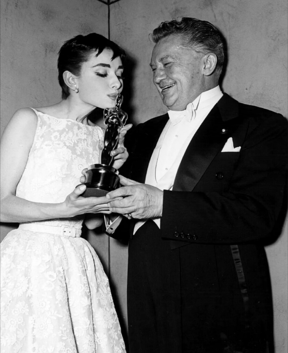 Audrey Hepburn on stage accepting her Oscar for Best Actress in a Leading Role for her performance in Roman Holiday in New York, March 25th, 1954 ​​​