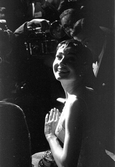 Audrey Hepburn on stage accepting her Oscar for Best Actress in a Leading Role for her performance in Roman Holiday in New York, March 25th, 1954 ​​​